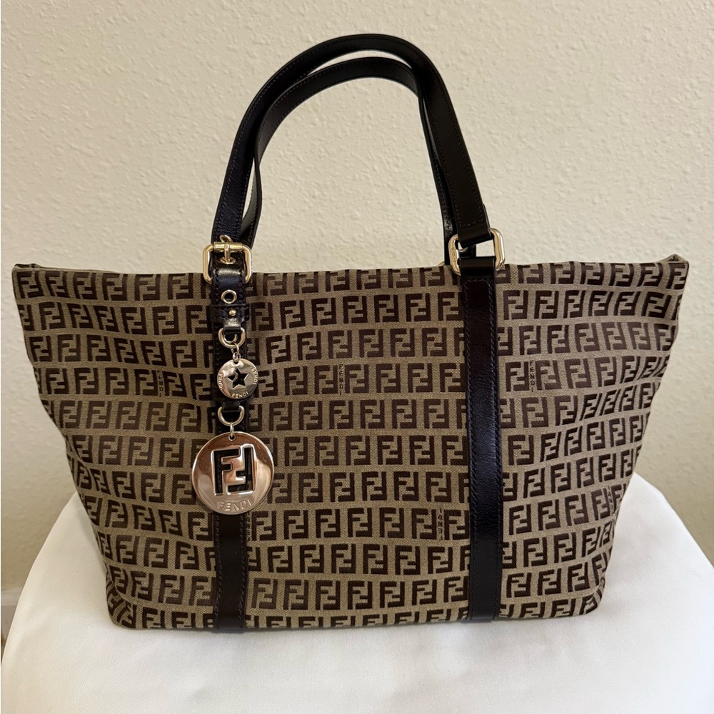 fendi zucchino canvas tote with charms. excellent condition.